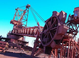 Transnet Freight Rail iron ore volumes rise as Sishen–Saldanha line remains below capacity Stacker reclaimer at Saldanha Iron Ore Terminal
